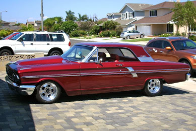 Thanks to 10+ years of effort by James Burrows, this 1964 Ford Fairlane Sport Coupe is equipped with numerous upgrades to its running gear. Acquired in 1995, this Crimson Pearl beauty runs a 393 c.i. engine, an AOD (automatic overdrive) transmission, 4-wheel disc brakes and a rack-and-pinion front-end.